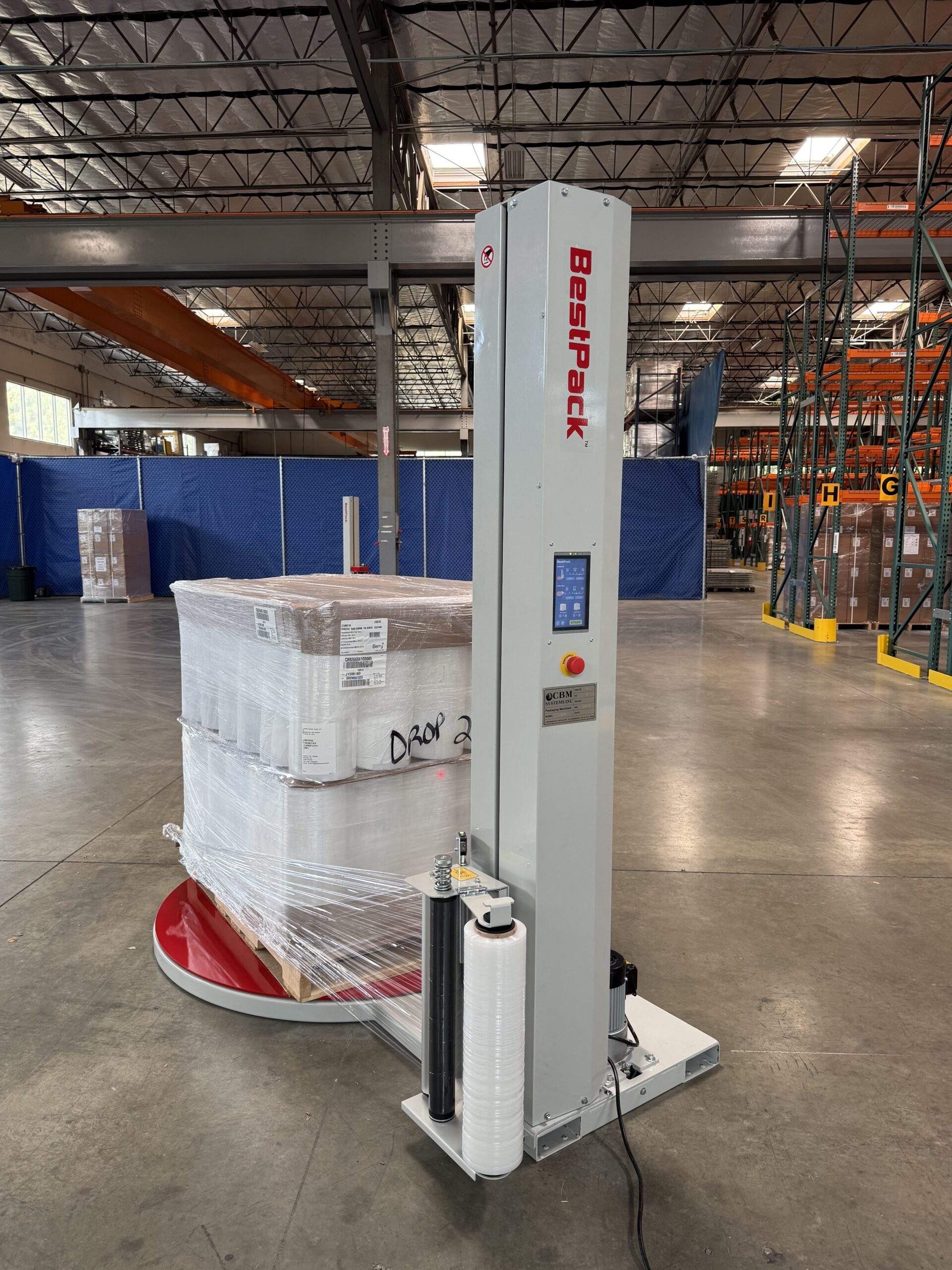 Reference photo showing the BestPack CBM B150i pallet wrapper in a warehouse at a different angle